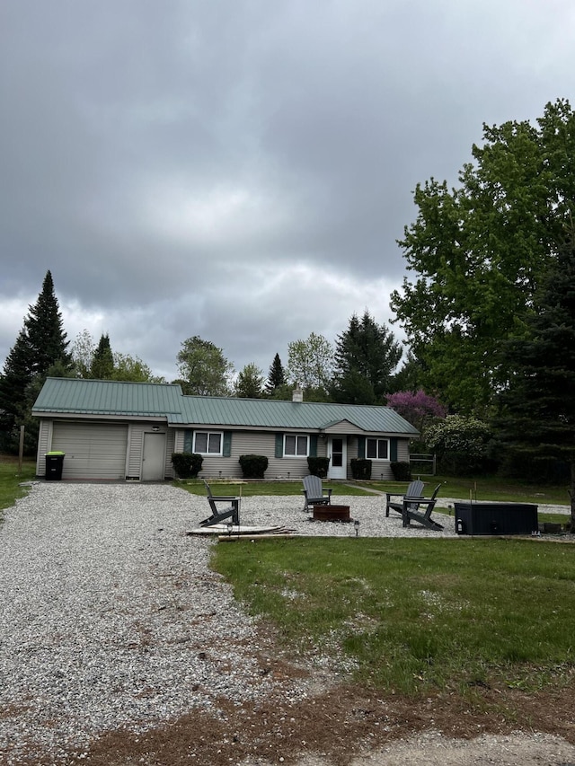 1828 Higgins, Saint Helen, MI 48656 - ranch-style home featuring an attached garage, metal roof, gravel driveway, and a chimney