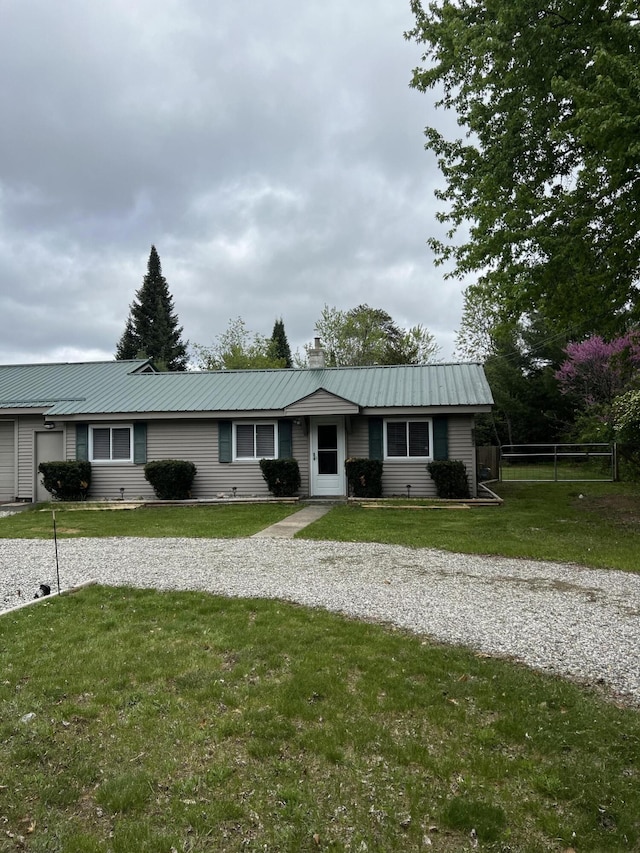 1828 Higgins, Saint Helen, MI 48656 - single story home with a chimney, metal roof, and driveway