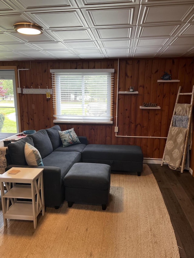 1828 Higgins, Saint Helen, MI 48656 - living room with wood walls, an ornate ceiling, and wood finished floors