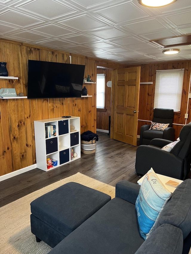 1828 Higgins, Saint Helen, MI 48656 - living area with wooden walls, an ornate ceiling, wood finished floors, and baseboards