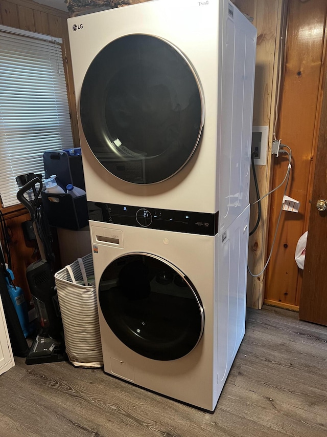 1828 Higgins, Saint Helen, MI 48656 - laundry area with stacked washer and clothes dryer and wood finished floors
