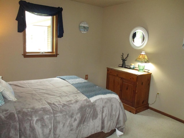 5622 Vacationland Dr, Lewiston, MI 49756 - bedroom featuring light colored carpet and baseboards