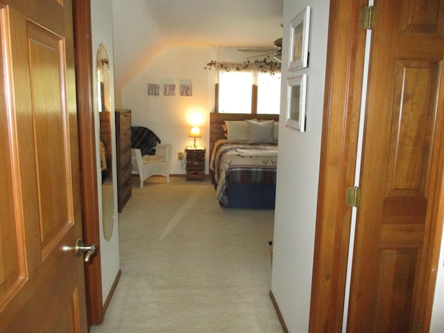 5622 Vacationland Dr, Lewiston, MI 49756 - bedroom with light carpet and vaulted ceiling