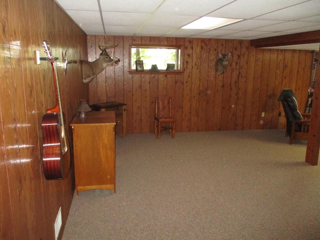5622 Vacationland Dr, Lewiston, MI 49756 - unfurnished office featuring carpet, wood walls, and a drop ceiling