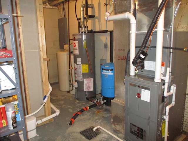5622 Vacationland Dr, Lewiston, MI 49756 - utilities with water heater, heating unit, and electric panel