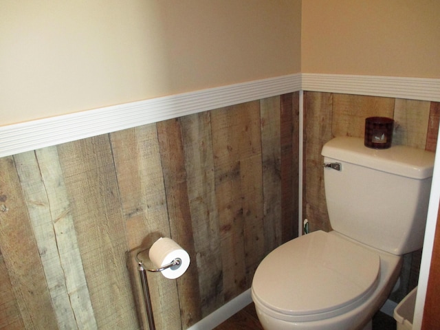 5622 Vacationland Dr, Lewiston, MI 49756 - bathroom featuring a wainscoted wall and toilet