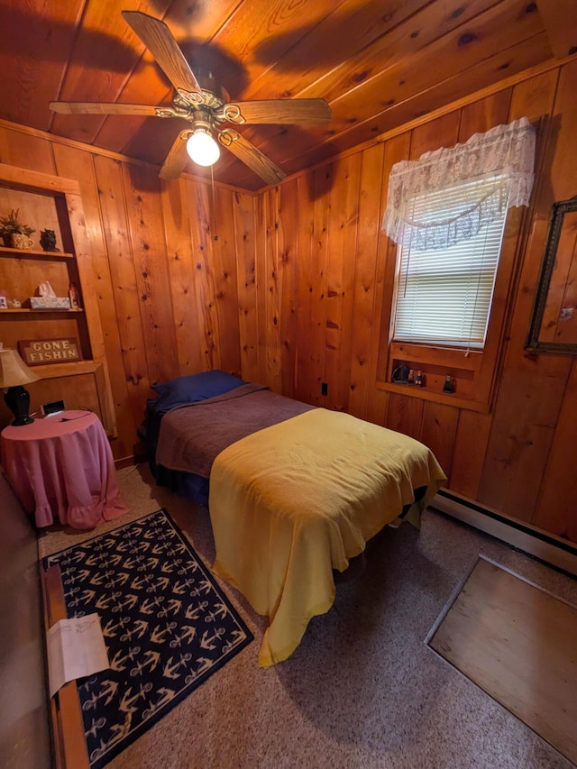 6783 E Houghton Lake Dr, Houghton Lake, MI 48629 - bedroom featuring baseboard heating, wooden ceiling, wooden walls, a ceiling fan, and carpet floors