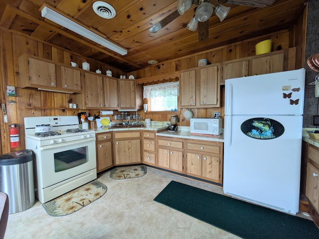 6783 E Houghton Lake Dr, Houghton Lake, MI 48629 - kitchen with white appliances, light countertops, open shelves, a ceiling fan, and wood walls