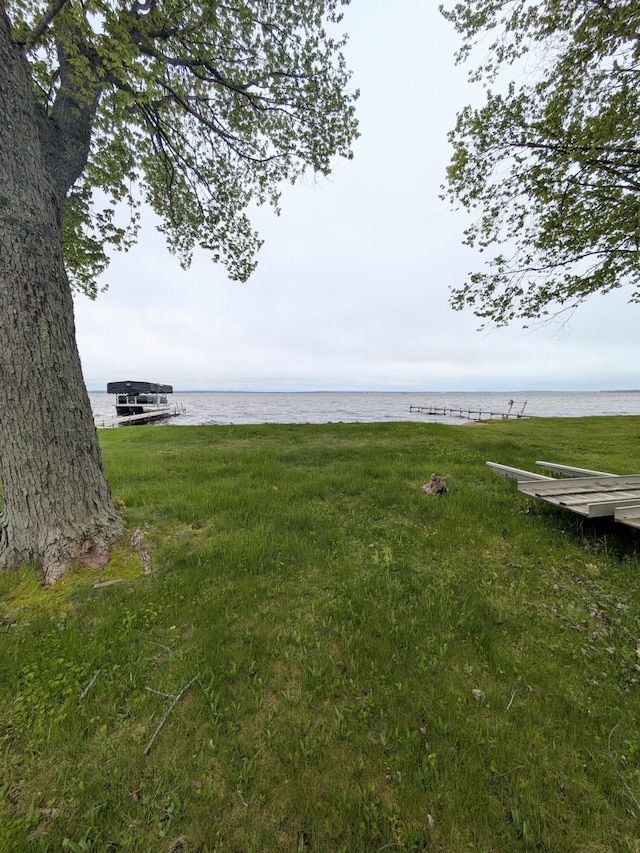 6783 E Houghton Lake Dr, Houghton Lake, MI 48629 - view of yard featuring a water view