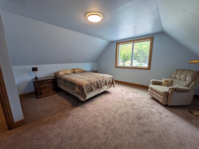 6783 E Houghton Lake Dr, Houghton Lake, MI 48629 - bedroom featuring carpet flooring, vaulted ceiling, and baseboards