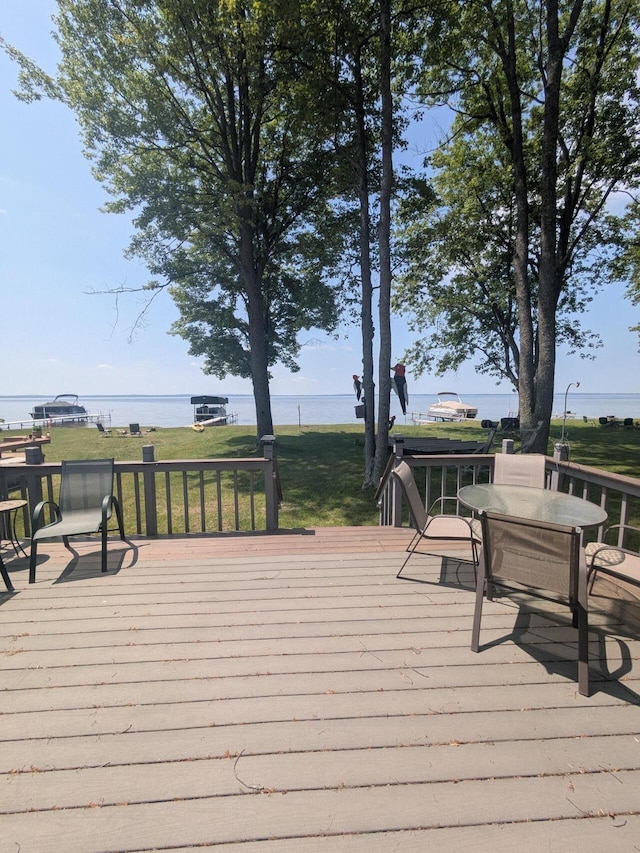 6783 E Houghton Lake Dr, Houghton Lake, MI 48629 - wooden terrace with a water view