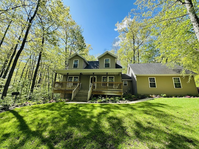 240 Monroe Blvd, Roscommon, MI 48653 - view of front facade featuring a front lawn and covered porch