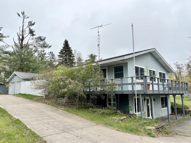 5356 Spruce Dr, Lewiston, MI 49756 - view of front of home with a wooden deck