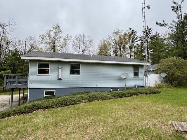 5356 Spruce Dr, Lewiston, MI 49756 - view of property exterior with a yard and a wooden deck