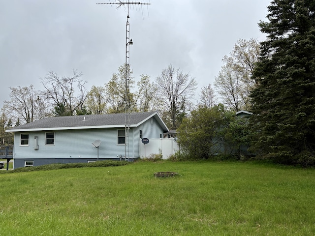 5356 Spruce Dr, Lewiston, MI 49756 - rear view of property featuring a lawn