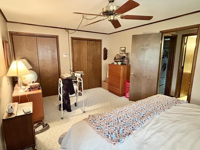 5356 Spruce Dr, Lewiston, MI 49756 - carpeted bedroom featuring multiple closets, a ceiling fan, and ornamental molding