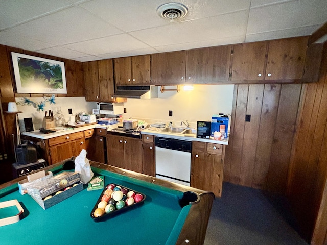 5356 Spruce Dr, Lewiston, MI 49756 - kitchen featuring dishwasher, a drop ceiling, a sink, under cabinet range hood, and light countertops