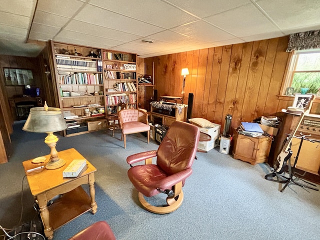 5356 Spruce Dr, Lewiston, MI 49756 - sitting room with wood walls, carpet floors, and a paneled ceiling