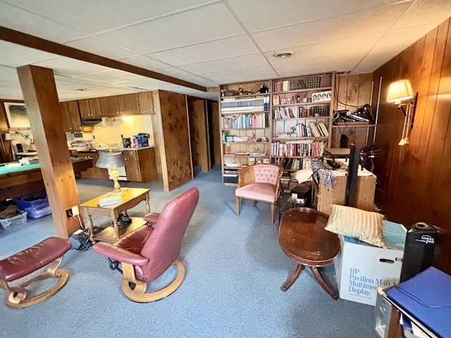 5356 Spruce Dr, Lewiston, MI 49756 - sitting room with wooden walls and a drop ceiling