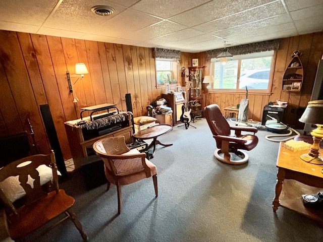 5356 Spruce Dr, Lewiston, MI 49756 - office area with wood walls, carpet floors, and a paneled ceiling