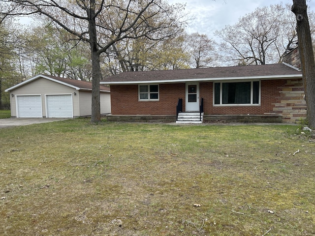 2323 Hobbs Dr, Alpena, MI 49707 - single story home featuring entry steps, brick siding, an outdoor structure, and a front lawn