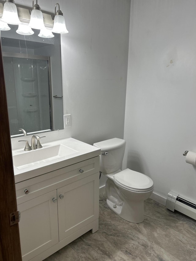 2323 Hobbs Dr, Alpena, MI 49707 - bathroom featuring baseboards, toilet, vanity, baseboard heating, and a shower