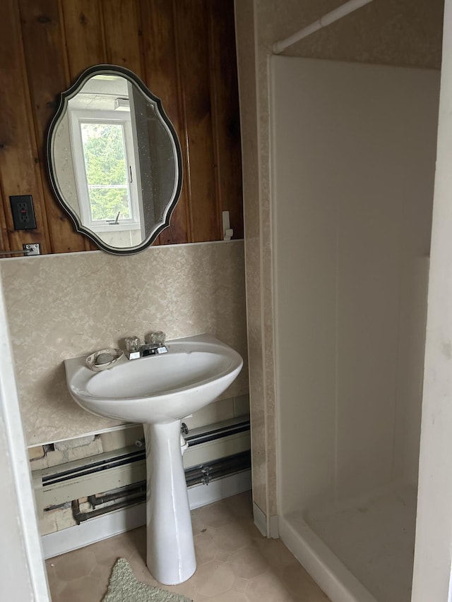 2323 Hobbs Dr, Alpena, MI 49707 - full bath featuring a stall shower, tile patterned flooring, and a sink