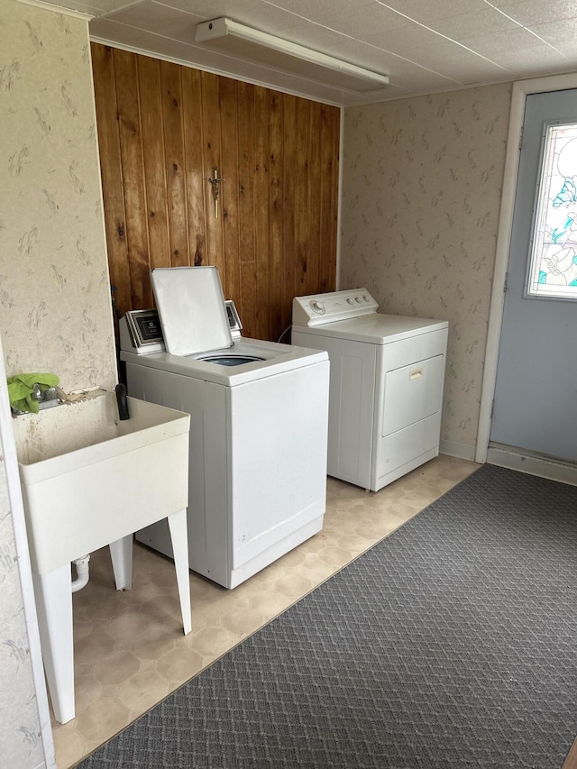 2323 Hobbs Dr, Alpena, MI 49707 - laundry area with independent washer and dryer and a sink