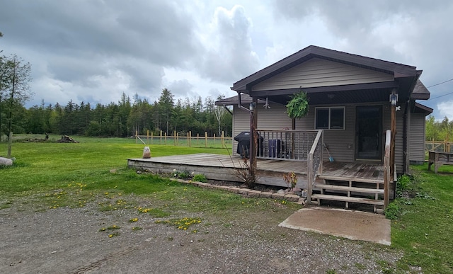 2460 Hamilton Rd, Alpena, MI 49707 - view of front of property featuring a deck and a front yard