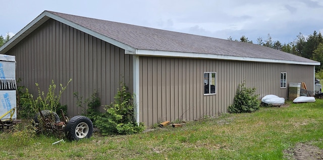 2460 Hamilton Rd, Alpena, MI 49707 - view of side of property with a yard and roof with shingles