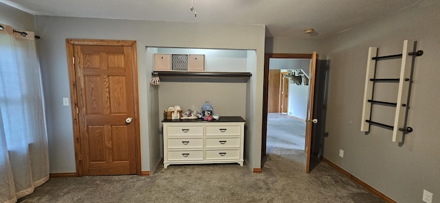 2460 Hamilton Rd, Alpena, MI 49707 - carpeted bedroom with a closet and baseboards