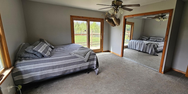 2460 Hamilton Rd, Alpena, MI 49707 - bedroom with carpet, access to outside, baseboards, a closet, and a ceiling fan