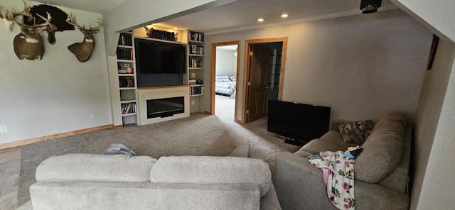 2460 Hamilton Rd, Alpena, MI 49707 - carpeted living room featuring crown molding, a fireplace, and recessed lighting