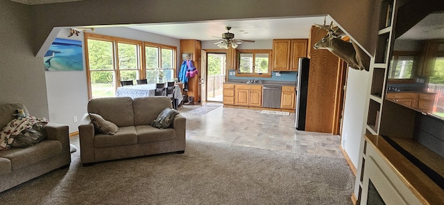2460 Hamilton Rd, Alpena, MI 49707 - living room with ceiling fan and light stone finish flooring