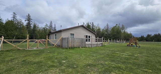 2460 Hamilton Rd, Alpena, MI 49707 - view of property exterior with a gate and a playground