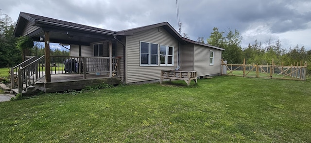 2460 Hamilton Rd, Alpena, MI 49707 - back of property featuring a wooden deck