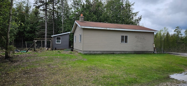 2460 Hamilton Rd, Alpena, MI 49707 - view of property exterior with a chimney