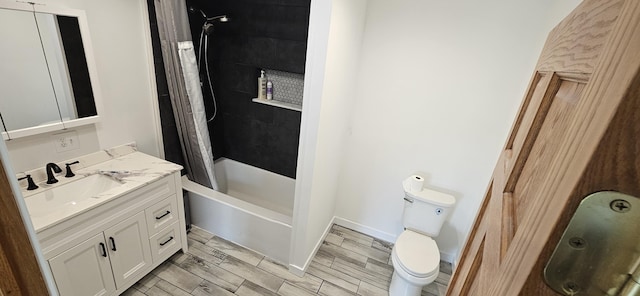 2460 Hamilton Rd, Alpena, MI 49707 - full bath featuring vanity, toilet, shower / bath combo with shower curtain, and wood tiled floors