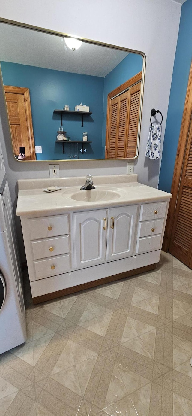 2460 Hamilton Rd, Alpena, MI 49707 - bathroom featuring vanity and a closet