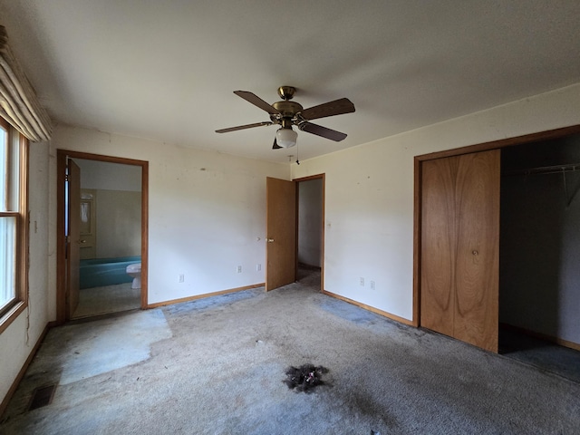3547 Kay Rd, Lewiston, MI 49756 - unfurnished bedroom featuring carpet flooring, a closet, connected bathroom, and ceiling fan