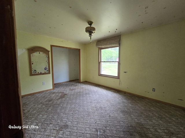 3547 Kay Rd, Lewiston, MI 49756 - carpeted empty room with baseboards