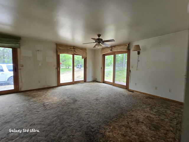 3547 Kay Rd, Lewiston, MI 49756 - carpeted spare room with a ceiling fan and baseboards