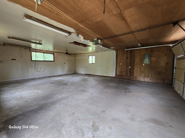 3547 Kay Rd, Lewiston, MI 49756 - garage featuring a garage door opener and electric panel