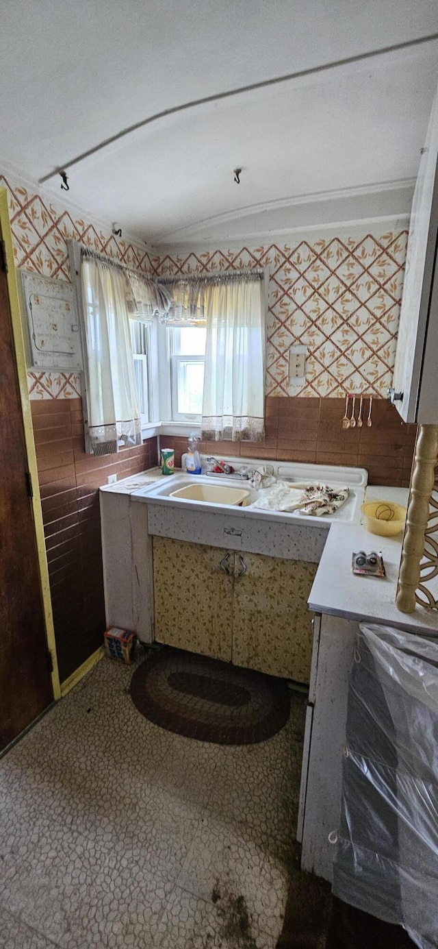 501 Sheridan St, Alpena, MI 49707 - kitchen with a sink and ornamental molding