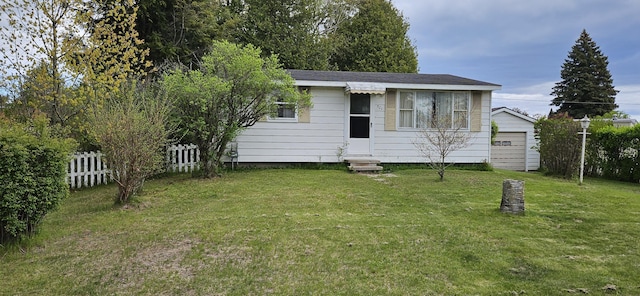501 Sheridan St, Alpena, MI 49707 - view of front facade with entry steps and a detached garage