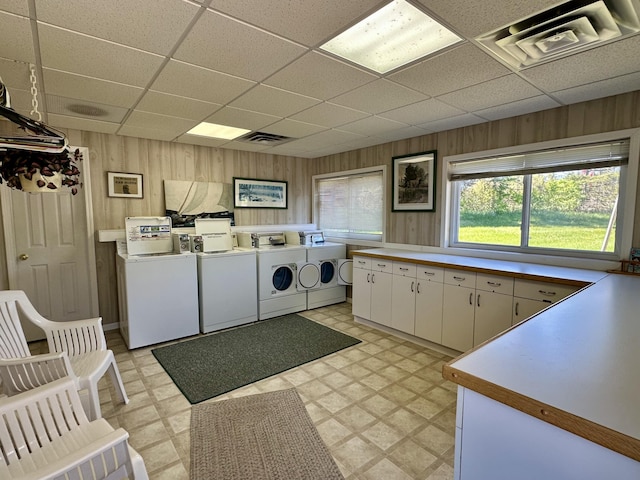 9452 M33, Cheboygan, MI 49721 - washroom with independent washer and dryer, wooden walls, light floors, and cabinet space