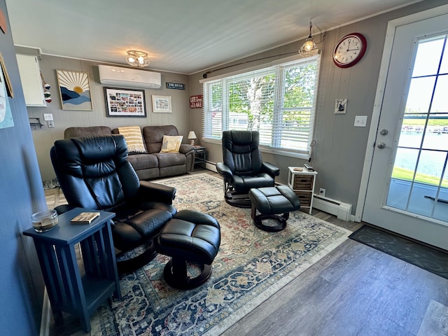 9452 M33, Cheboygan, MI 49721 - living area with an AC wall unit, wood finished floors, baseboard heating, plenty of natural light, and ornamental molding