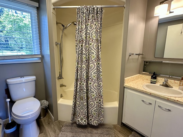 9452 M33, Cheboygan, MI 49721 - bathroom with shower / bath combo with shower curtain, vanity, toilet, and wood finished floors