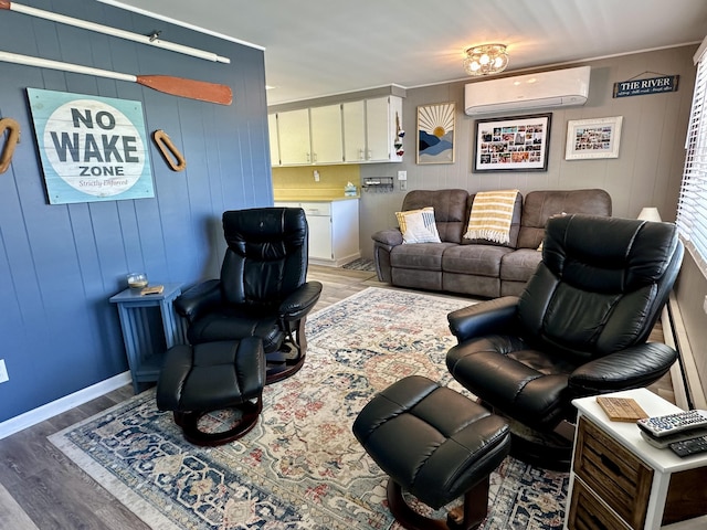 9452 M33, Cheboygan, MI 49721 - living room with an AC wall unit, light wood-style flooring, wood walls, and baseboards