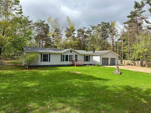 1085 Five Lakes Rd, Gaylord, MI 49735 - view of front of home featuring a garage, a front yard, driveway, and crawl space